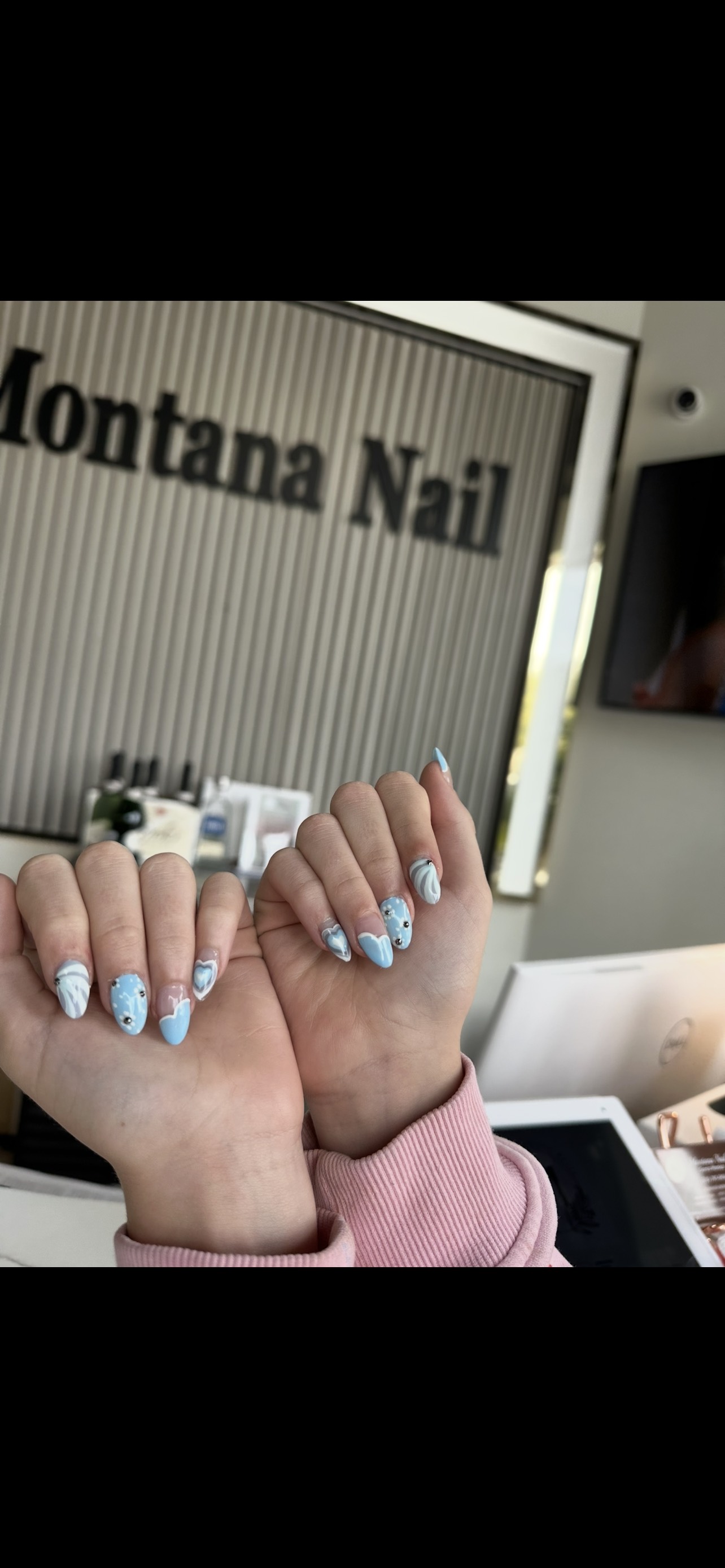 Blue nail design photographed inside Montana Nails salon